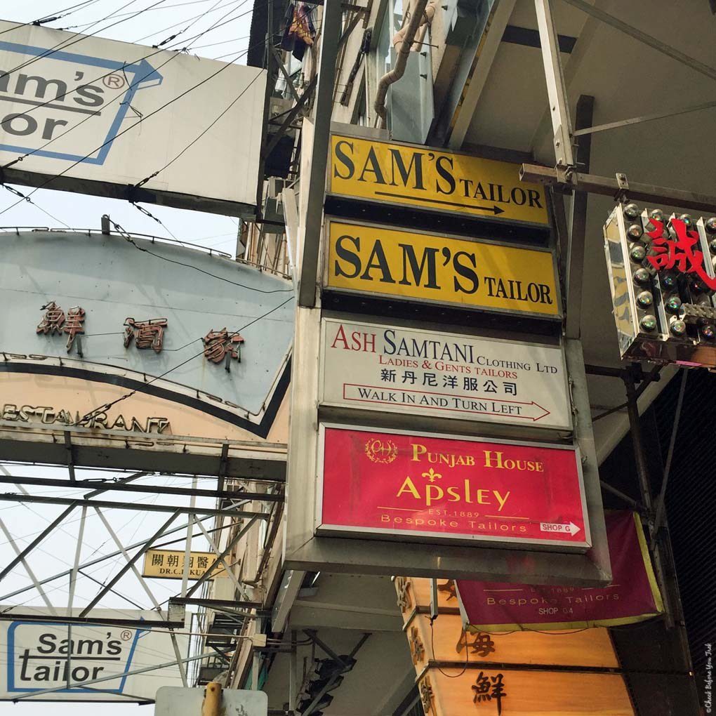 Sign on Nathan Road directing you to Sam's Tailor - Tsim Sha Tsui, Hong Kong, China (Photograph from the website: Check Before You Trek)