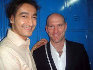 Lawrence Dallaglio measures up with Roshan Melwani in a locker room