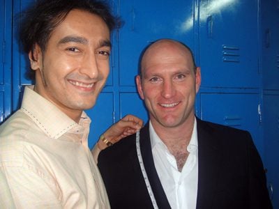 Lawrence Dallaglio measures up with Roshan Melwani in a locker room