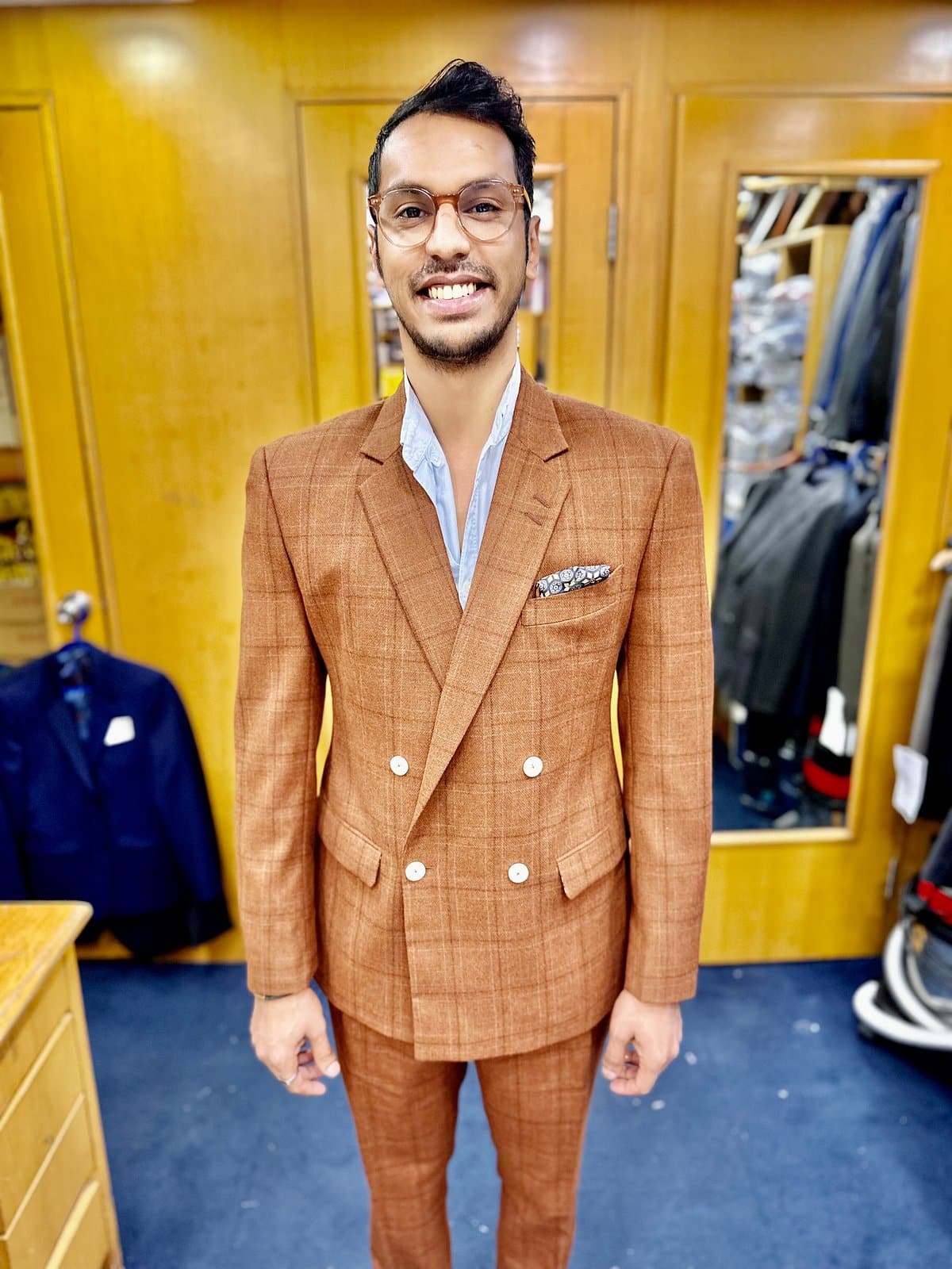 Groom's Guide: Wedding Suit in Hong Kong 1 A brown two-piece suit cut by Sam's Tailor, photographed on a model in Hong Kong